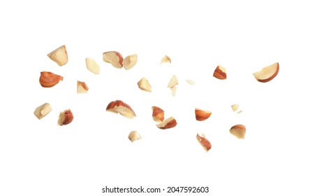 Pieces of tasty hazelnuts on white background - Shutterstock ID 2047592603