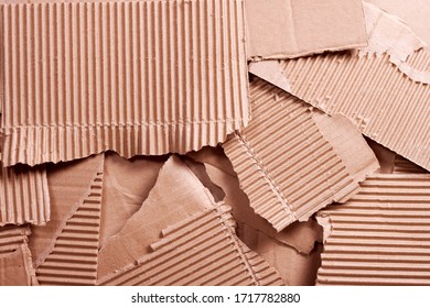 Pieces Of A Torn Cardboard Box. Background Image. Paper Recycling Concept, Paper Waste Recycling, Eco-friendly Production, Household Waste, Packaging.