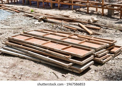 The pieces of wooden mold used for pouring concrete or cement .
 - Powered by Shutterstock