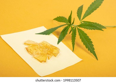 pieces of yellow cannabis wax, marijuana concentrate high in THC.