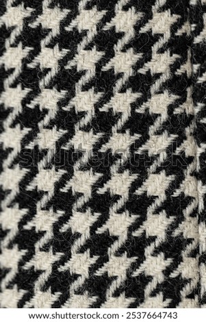 Pied de Poule pattern on a woolen fabric, a  fashion classic with Houndstooth or Border Tartan dessin, from the Scottish Tartan Fabrics Family. Wealth and luxury symbol , detail shot