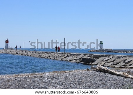 Pier along waterfront trail in Pickering, Ontario, Canada; Frenchman's Bay harbour entrance