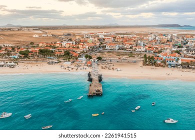 Pier and boats on turquoise water in city of Santa Maria, Sal, Cape Verde - Shutterstock ID 2261941515