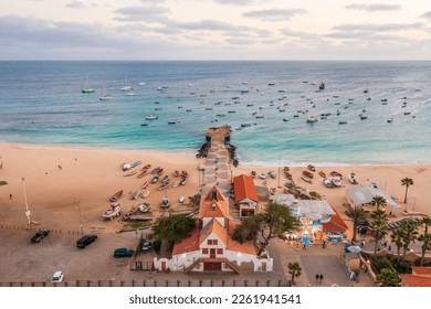 Pier and boats on turquoise water in city of Santa Maria, Sal, Cape Verde - Shutterstock ID 2261941541