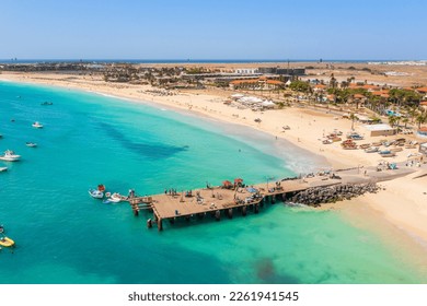 Pier and boats on turquoise water in city of Santa Maria, Sal, Cape Verde - Shutterstock ID 2261941545