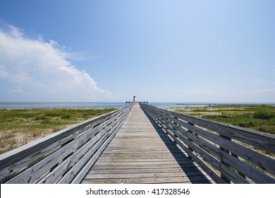 Pier Leading To Gulf Of Mexico At Grand Isle, Louisiana