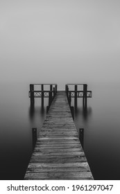 Pier Leading Into A Lake In A Foggy Afternoon In Te Anau, New Zealand