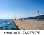 The pier "Molo Audace" along the shores of Trieste stretching out in the sea, in front of Piazza Unità d