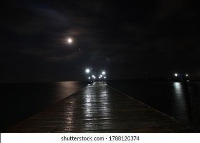 pier in the moonlight at night, night beach lights, night seascape - Powered by Shutterstock