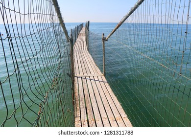 Pier with net fencing. - Powered by Shutterstock