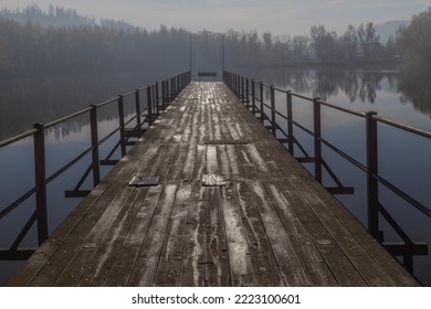 A pier on a lake on a foggy day - Powered by Shutterstock