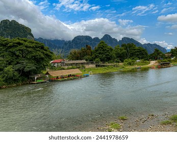 Pier with river and mountain range, road,