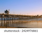 The pier in San Clemente, on the California coast, extends from the beach and well into the Pacific Ocean