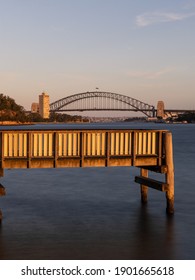 Pier And Sydney Harbour Bridge Under The Golden Light.