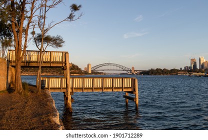 Pier And Sydney Harbour Bridge Under The Golden Light.