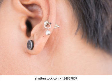 Pierced Ear Of A Young Man