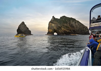 Piercy Island, New Zealand - December 30, 2019 : Cruise out amongs the islands and see the  famous Hole in The Rock in New Zealand North Island.