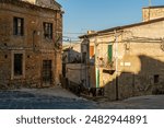 Pietraperzia, Sicily, Italy. Historical city center. The street - Via Caterva intersects with Via Carmine. Summer sunny day