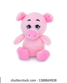 Pig plushie doll isolated on white background with shadow reflection. Hog plush stuffed puppet on white backdrop. Colored stuffed pig toy. Pink pig.