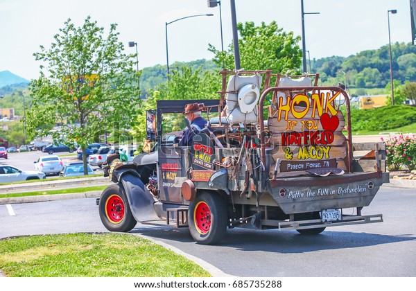 PIGEON FORGE\
,TENNESSEE ,USA - MAY 11 ,2015 : The Old man and Ancient car in Top\
Tourist Attractions of\
Tennessee.