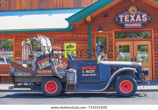 PIGEON\
FORGE ,TENNESSEE ,USA - MAY 11 ,2015 : Ancient car and Country\
house in Top Tourist Attractions of\
Tennessee,USA