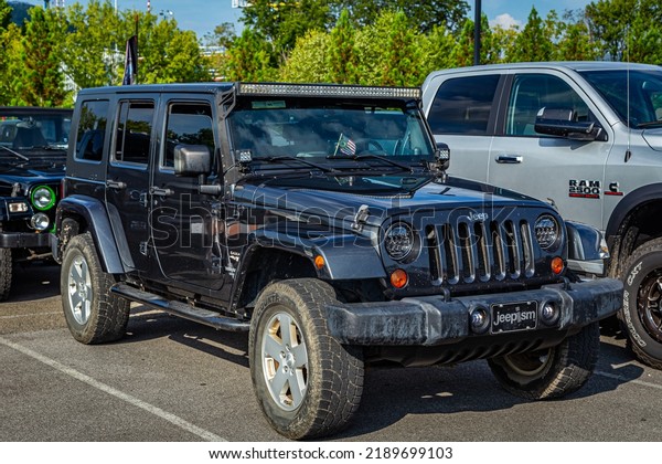 Pigeon\
Forge, TN - August 25, 2017: Modified Off Road Jeep Wrangler Sport\
JK Unlimited Hardtop at a local enthusiast\
rally.