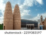 Pigeon Towers in Katara Cultural Village in Doha. Pigeon towers and blue sky near Mosque in Katara, cultural village, Valley of Cultures, West Bay, Doha, Qatar, Middle East