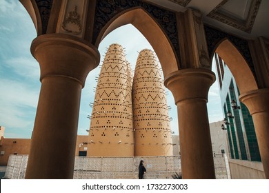 Pigeon towers of the Katara cultural village in Doha,Qatar framed through an arch. Katara is located on the eastern coast between West Bay District and the Pearl-Qatar