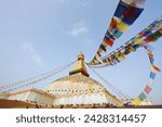 Pigeons and prayer flags on boudha stupa (chorten chempo), boudhanath, kathmandu, nepal, asia