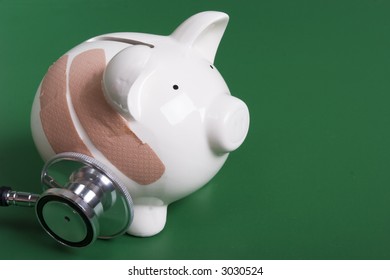 Piggy Bank With  Band Aids And Stethoscope