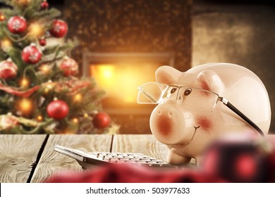 Piggy bank and christmas interior with fireplace and xmas tree 