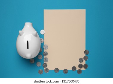 Piggy Bank, Coins And Blank Paper Sheet On Color Background. Savings Concept