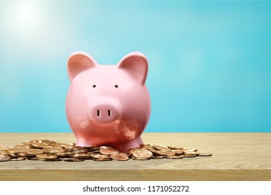 Piggy bank and coins on white background
