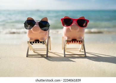 Piggy Bank With Deckchair On Sandy Beach - Powered by Shutterstock