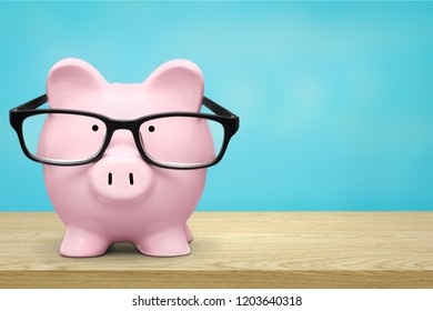 Piggy Bank In Glasses On Background