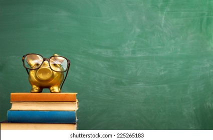 piggy bank with glasses on books, education concept