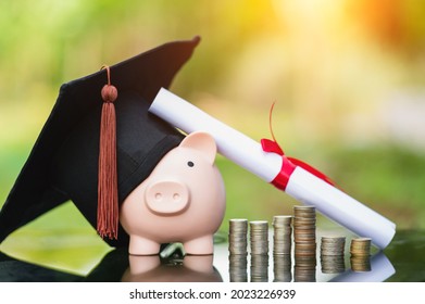 Piggy Bank With Graduation Cap On Black Glass Floor,Money Saving Concept.	