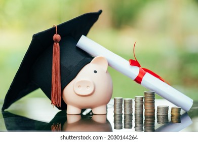 Piggy Bank With Graduation Cap On Black Glass Floor,Money Saving Concept.	