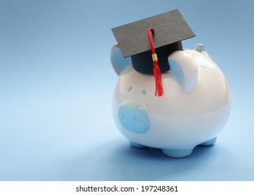 Piggy Bank With A Graduation Mortar Board Cap Concept For The Cost Of A College Education