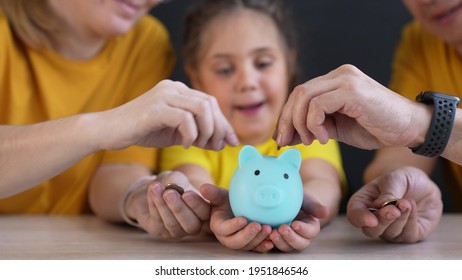 piggy bank. happy family a save money. investment business finance piggy bank concept. happy family hands holding piggy bank. kid and parents put coins in investment lifestyle money box