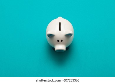 Piggy bank isolated on aquamarine  background  - Shutterstock ID 607233365