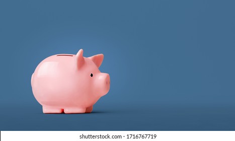Piggy bank isolated on blue background