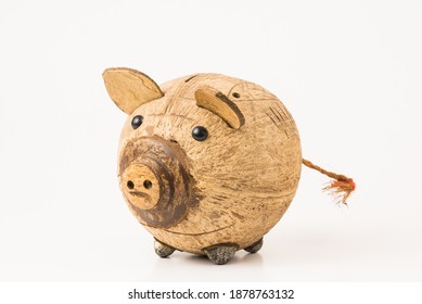 piggy bank isolated on white made of coconut