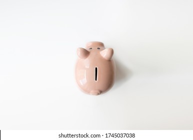 A Piggy Bank With Money Top View