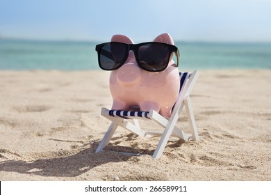 Piggy Bank On Deckchair With Sunglasses 