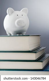 Piggy Bank Over A Stack Of Books