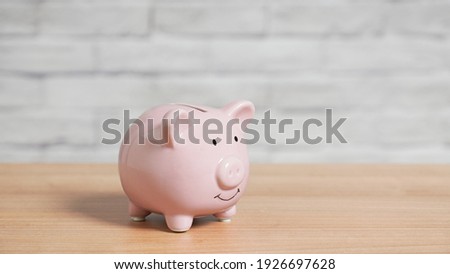 Piggy bank or piggybank on table with copy space