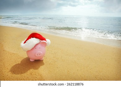 Piggy Bank With Santa Hat At Beach - Australian Christmas Savings