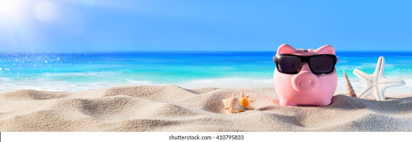 Piggy Bank With Sunglasses On The Beach Holiday
