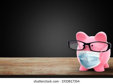 Piggy Bank Wearing A Surgical Face Mask During Coronavirus Pandemic.